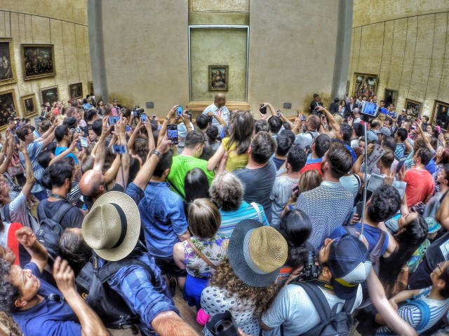 A gathered crowd in front of the Mona Lisa